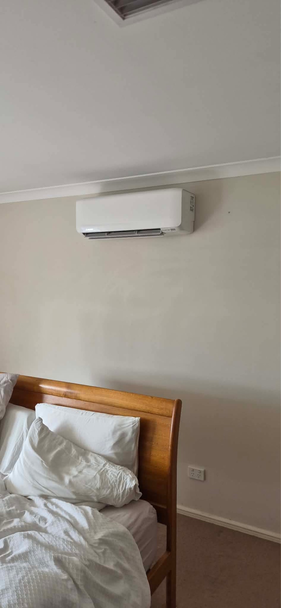 Split system indoor unit installed in bedroom